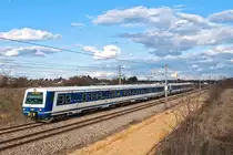 6020 213 ist mit dem Schnellbahnzug 29639 nach Wien Meidling unterwegs. Helmahof, am 24.02.2016.