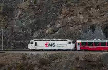 RhB Ge 4/4 III 643  Ems  mit dem RE nach Chur kurz nach dem Landwasserviadukt und somit auch kurz vor dem Schmittentobel-Viadukt. 28.02.2016