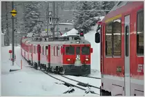 R1644 wartet in Cavaglia den R1625/BEX953 ab, der mit zwei ABe 4/4 III verkehrt. (25.02.2016)