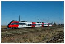  4024 013 als REX 2627 von Pamhagen nach Wien S�d am 11.3.2007 bei der Ausfarht aus Gramatneusiedl. Damit endet meine Fotoserie von diesem Tag in und um Gramatneusiedl.