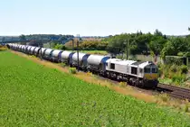 077 012 der MEG mit Kesselwagen bei Zschortau am 31.08.2016.
