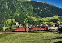 Eine Re 10/10, bestehend aus den Lokomotiven Re 4/4 II 11281 und Re 6/6 11683  Immensee , donnert oberhalb der Ortschaft Wassen mit einem KLV den Gotthard hinauf.
Aufgenommen am 19.7.2016.