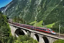 Ein ETR 610 der FS fährt als EC 21 (Zürich HB - Milano Centrale), über die mittlere Meienreussbrücke bei Wassen.
Aufgenommen am 19.7.2016.	