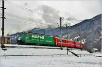 RE1045 nach Davos Platz mit Ge 4/4 III 647  Grüsch  in der Neugutkurve bei Landquart. (04.01.2017)