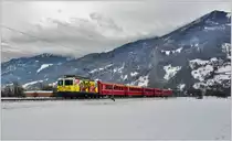 RE1343 mit Ge 4/4 II 611  Landquart  zwischen Landquart und Malans. (04.01.2017)