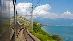 Mit dem IR, gezogen von einer Re 460, geht von Lausanne wieder zur�ck nach Vevey, hier am 26.05.2012 bei St.