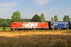 185 399 von  DB Schenker, mit Stahlzug in Richtung Aachen am 23.7.2014 auf der KBS 485 im Wurmtal.