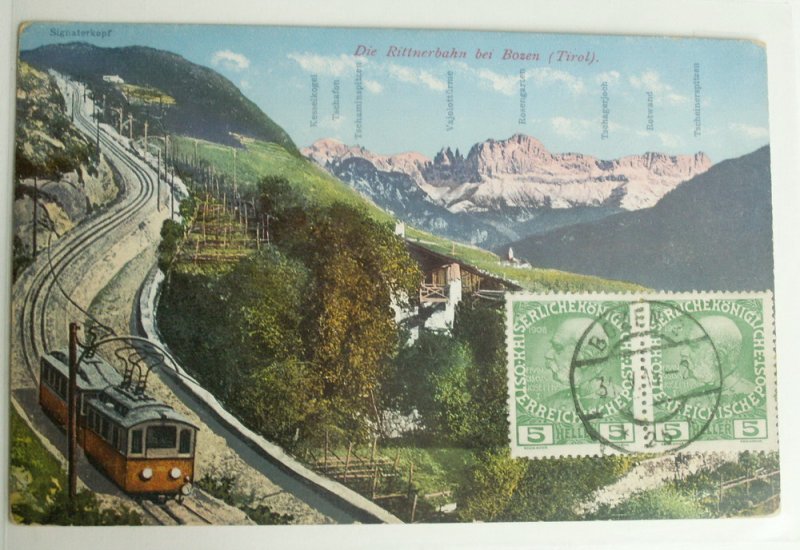 Zeitdokument:AK von 1917 zu Zeit der k.+k.Monarchie.Sie zeigt die 25% Steilstrecke von Bozen nach Maria Himmelfahrt mit einem zweiachsigen Rittnerbahntriebwagen und einer Zahnrad E-Lok.1966 wurde die Bergstrecke durch eine Luftseilbahn ersetzt.Seither verkehren die Triebwagen nur noch auf der oberen Adhsionsstrecke zwischen Maria Himmelfahrt-Oberbozen-Klobenstein.Von den ursprnglich vier Zahnradloks sind noch zwei restauriert und rollfhig erhalten.Eine Originallok sieht man u.a.auf meinen Rittnerbahn Bildern(Sammlung P.Walter)