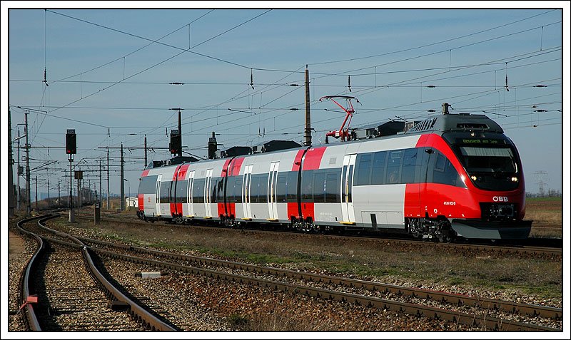 Zweisystemtalent 4124 002 als REX 2623 von Wien nach Neusiedl am See am 11.3.2007 bei der Einfahrt in Gramatneusiedl.